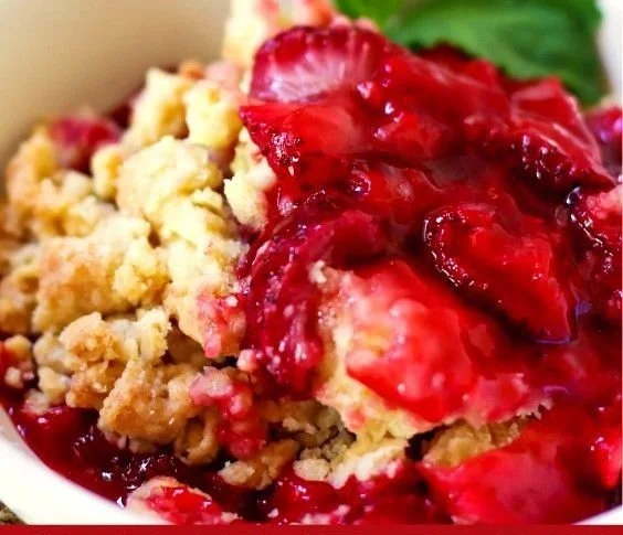 Delicious strawberry cobbler dessert with fresh strawberries and a golden topping