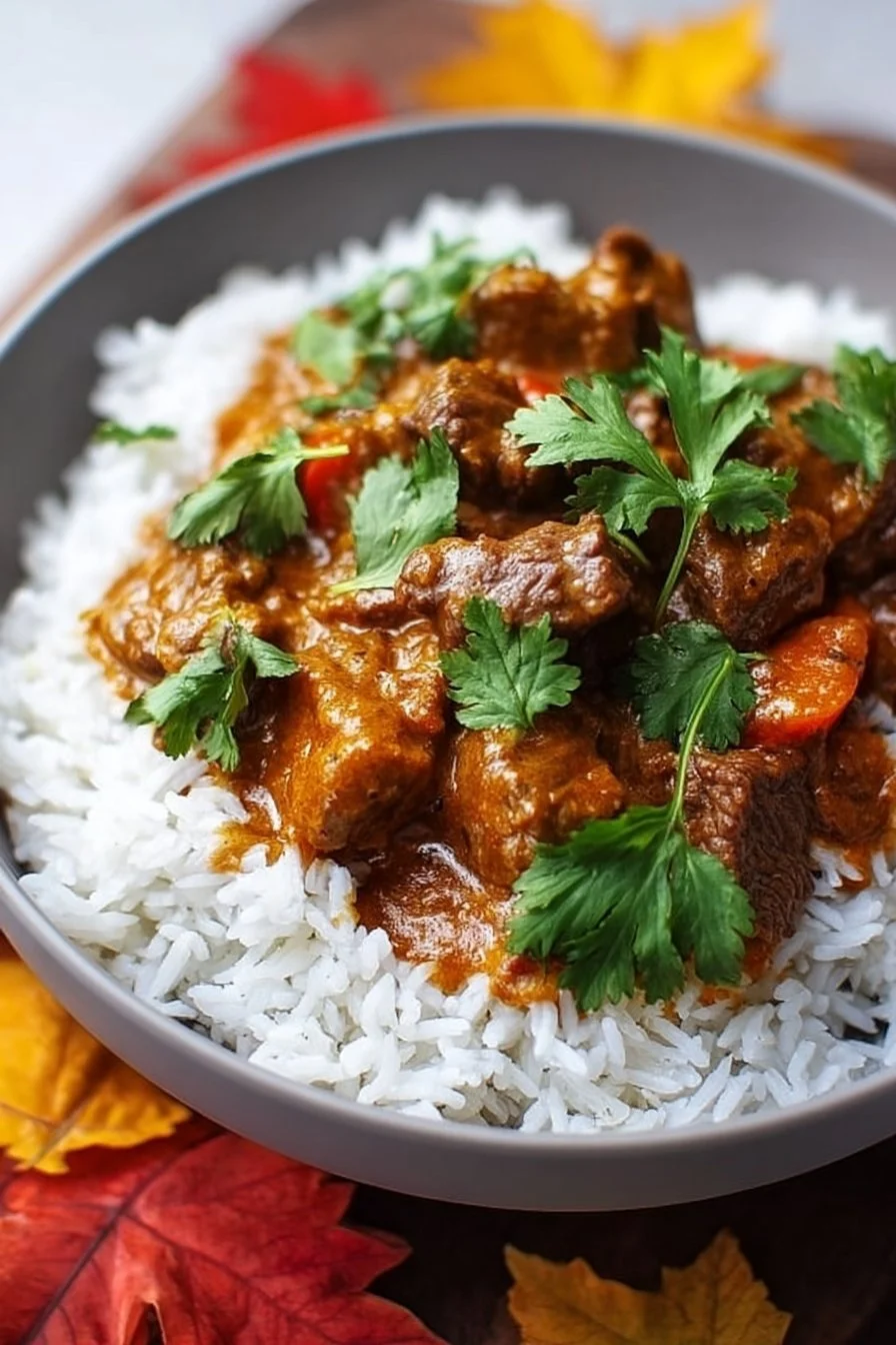 Delicious slow cooker beef coconut curry with vibrant spices and ingredients