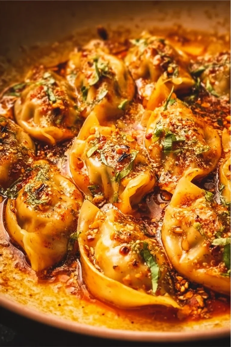 Viral baked dumplings served with dipping sauce on a plate