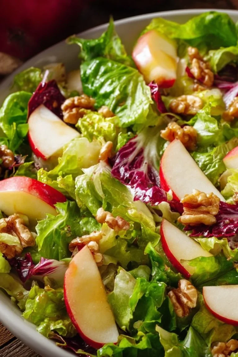 A delicious apple salad made with fresh ingredients and colorful toppings.