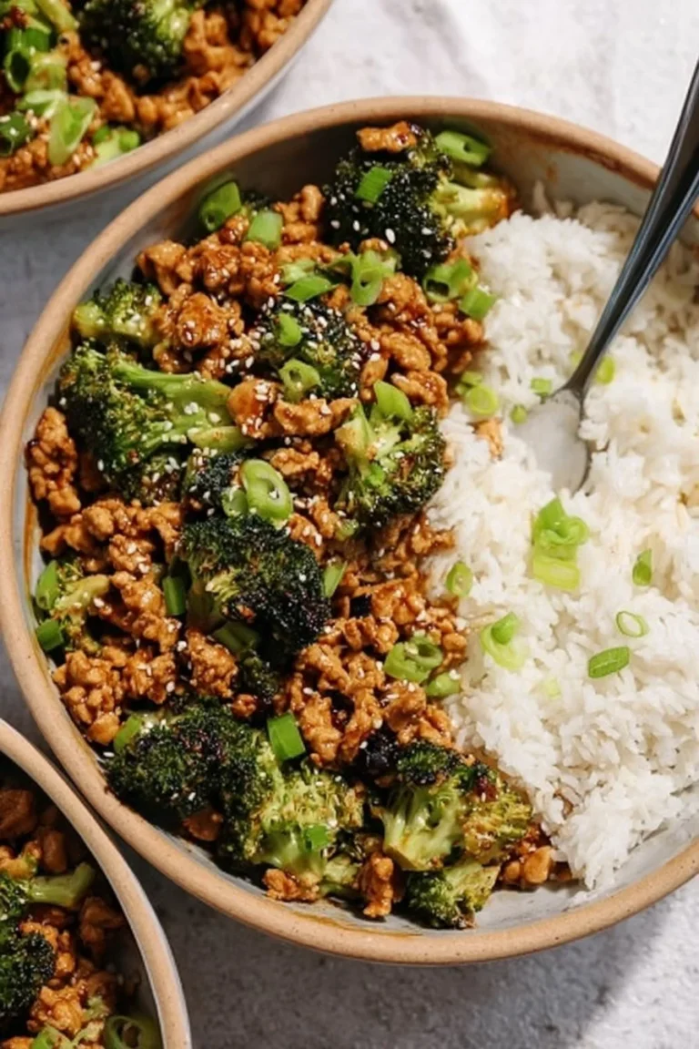 Sweet and Spicy Ground Chicken and Broccoli dish garnished with sesame seeds