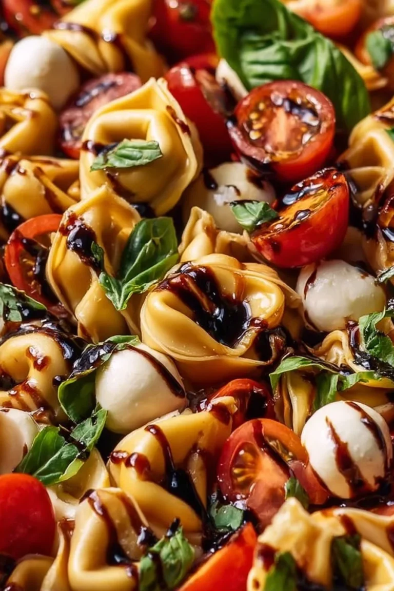 Delicious Caprese Tortellini Salad with tomatoes, mozzarella, and fresh basil
